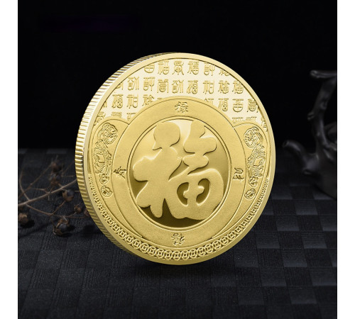 Золота монета Бог Багатства на злитці