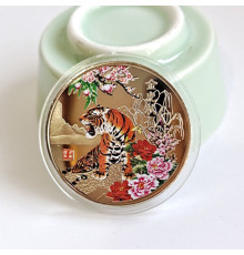 Монета Тигр уособлюють силу, гроші та удачу