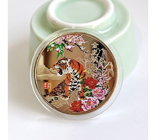 Монета Тигр уособлюють силу, гроші та удачу