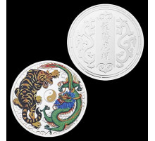 Монета дракон і тигр, що разом вважається в міфології символами удачі, мудрості, просвітління й влади