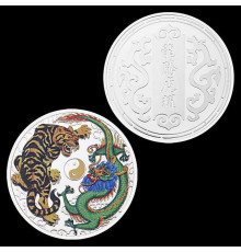Монета дракон і тигр, що разом вважається в міфології символами удачі, мудрості, просвітління й влади