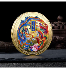 Монета Дракон і Фенікс із мантрою, що виконує бажання