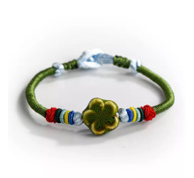 Сакральний Тибетський браслет ручної роботи із зеленим конюшином на багатство та здоров'я