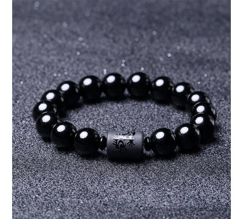 Бусина Дзі Дракон у браслеті з чорного обсидіана підсилює енергетику людини, удачу та здоров'я