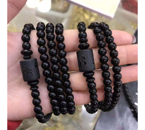 Бусина Дзі Дракон у браслеті з чорного обсидіана підсилює енергетику людини, удачу та здоров'я