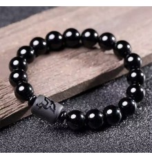 Бусина Дзі Фенікс у браслеті з чорного обсидіана підсилює енергетику людини, удачу та здоров'я активує