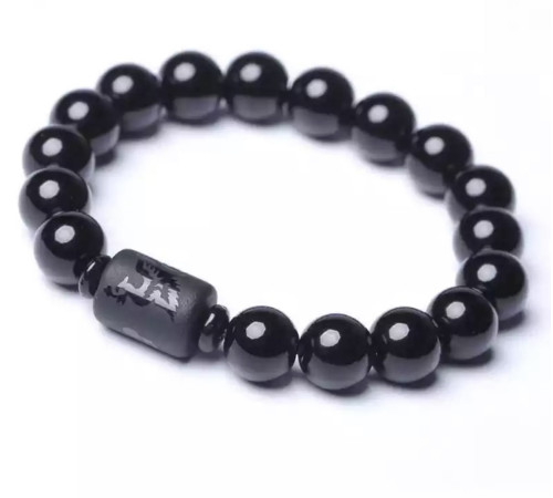 Бусина Дзі Фенікс у браслеті з чорного обсидіана підсилює енергетику людини, удачу та здоров'я активує