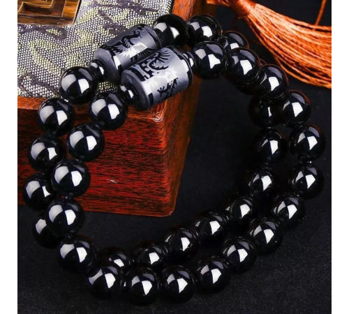 Бусина Дзі Фенікс у браслеті з чорного обсидіана підсилює енергетику людини, удачу та здоров'я активує