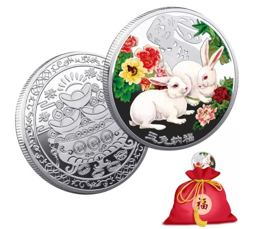 Срібна монета білі кролики для нових можливостей і грошей
