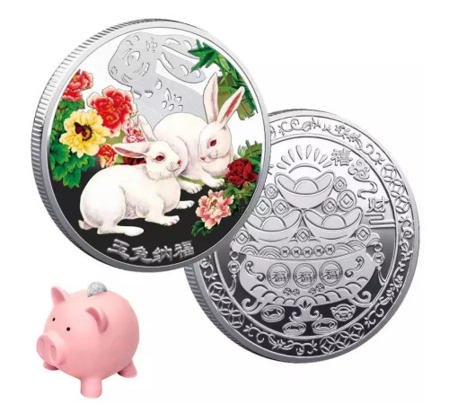 Срібна монета білі кролики для нових можливостей і грошей