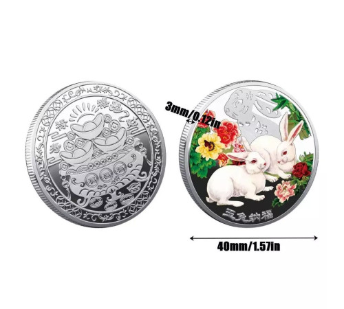 Срібна монета білі кролики для нових можливостей і грошей