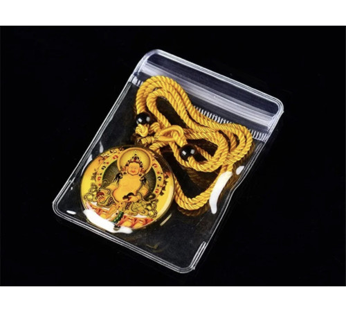 Тибетська підвіска Жовтий Джамбала Бурштиновий — тибетський бог багатства з мантрою